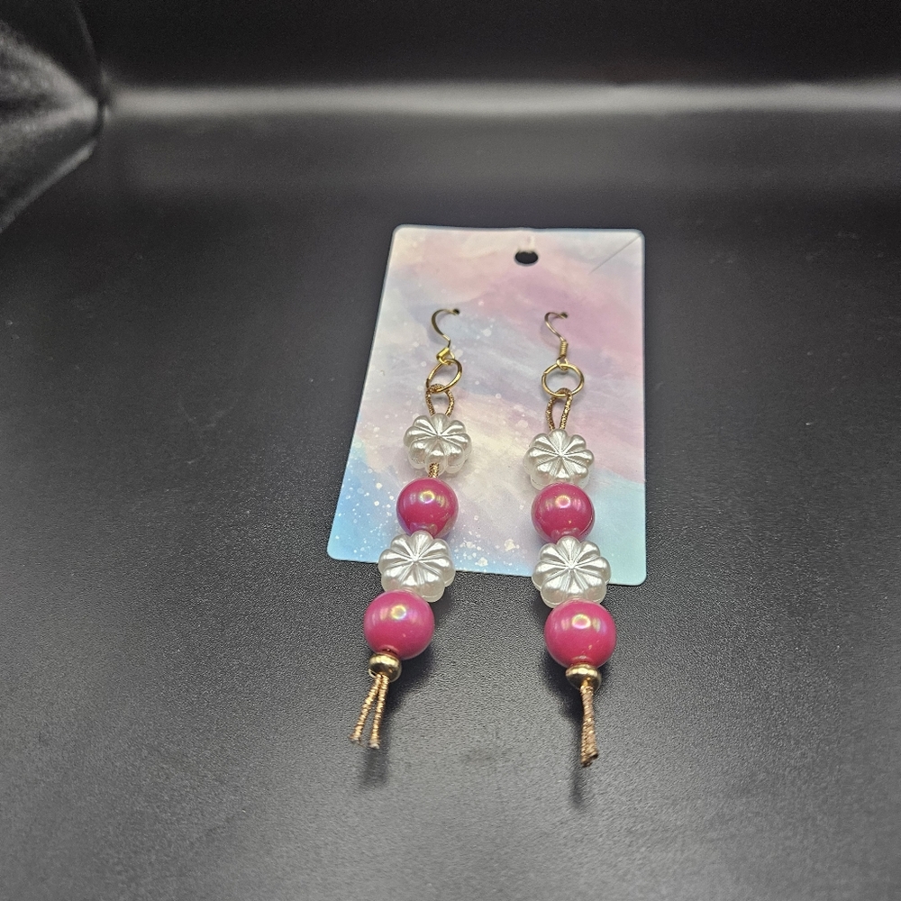 Pink and white dangles on a rope